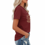 Women wearing Vale branded cotton graphic t-shirt with butterfly and floral swirl design, available in Maroon, Grey, and Cream colors.