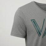 Front view of a VALE brand scoop neck t-shirt for men in grey, white, and blue colors featuring a green geometric logo.