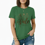 Female model wearing a Vale Limited Edition floral graphic t-shirt made of breathable cotton, featuring copper metallic flower design and script lettering.