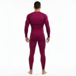 Front view of a man wearing a VALE brand long-sleeve compression shirt and matching leggings set in breathable fabric, available in white, navy blue, and maroon.