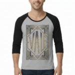 Man wearing a VALE Art Deco graphic raglan shirt made of breathable cotton with 3/4 sleeves.
