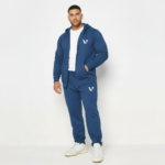 Men's premium breathable cotton tracksuit featuring a full-zip hoodie and matching joggers with minimalist branding, available in Black, Green, and Blue.