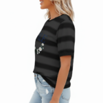 Women's breathable cotton striped t-shirt with puff sleeves and floral VALE graphic print, styled with light wash denim jeans.