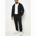 Men's premium cotton zip-up tracksuit featuring a hooded sweatshirt and matching joggers with geometric side-stripe detailing and VALE logo.