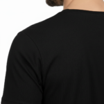 Close-up of a deep scoop neck shirt showing high-grade pique cotton texture.