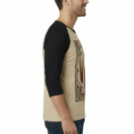 Man wearing a VALE Art Deco graphic raglan shirt made of breathable cotton with 3/4 sleeves.