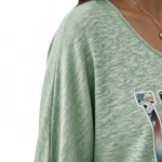 Women's breathable cotton VALE graphic top with floral lettering and smocked puff sleeves.