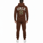 Men's breathable cotton tracksuit set showing a large varsity VALE back graphic with a gate emblem and Roman numerals on the hoodie and joggers.