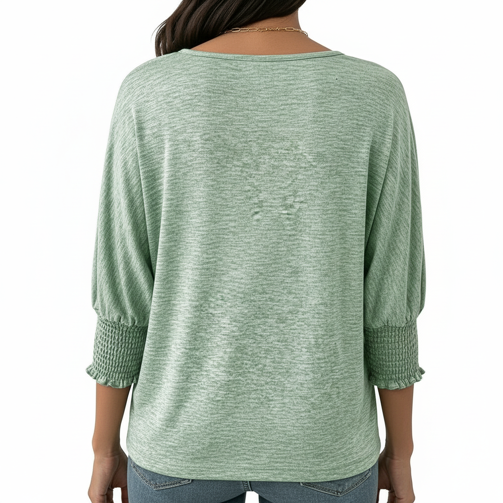 Women's breathable cotton VALE graphic top with floral lettering and smocked puff sleeves.