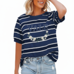 Women's breathable cotton striped t-shirt with puff sleeves and floral VALE graphic print, styled with light wash denim jeans.