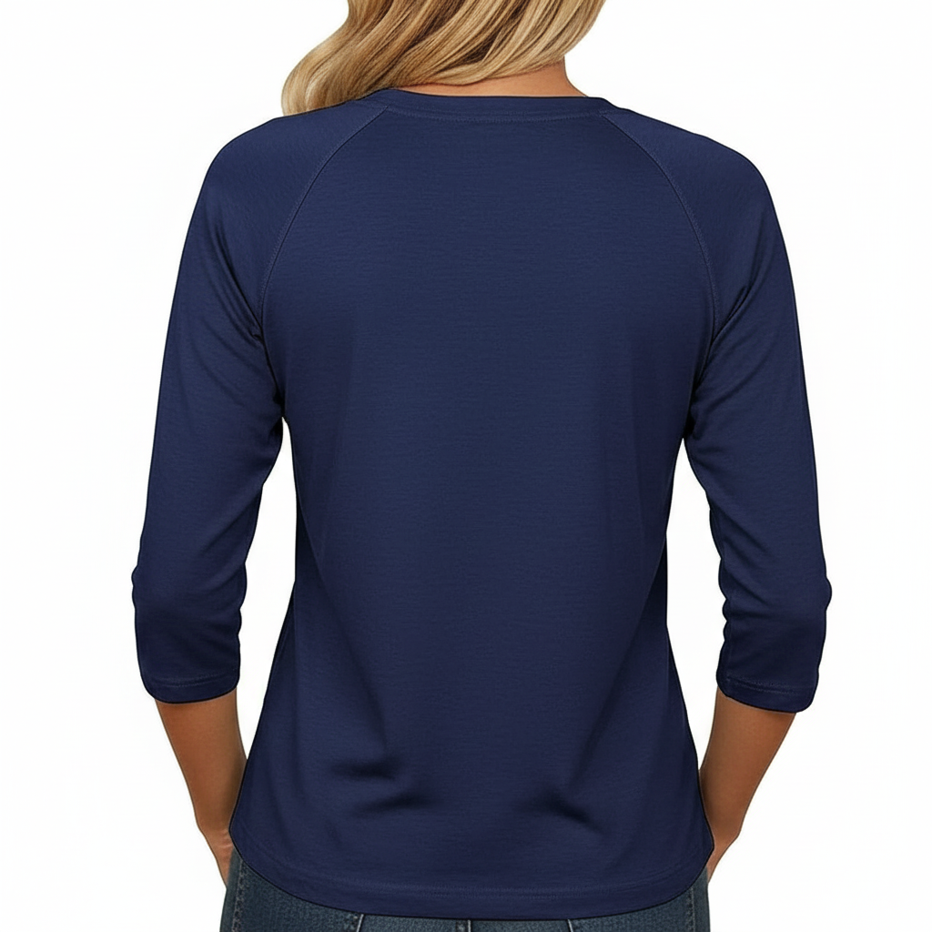 Woman wearing a breathable cotton 3/4 sleeve raglan shirt featuring a gold-toned floral "VALE" crest design, available in Navy Blue, Earthy Brown, and Maroon.
