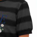 Women's breathable cotton striped t-shirt with puff sleeves and floral VALE graphic print, styled with light wash denim jeans.