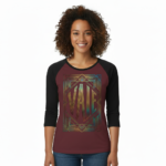 Woman wearing a VALE Art Deco graphic raglan shirt made of breathable cotton with black 3/4 sleeves, available in cream, maroon, and grey.