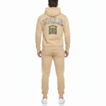 Men's breathable cotton tracksuit set showing a large varsity VALE back graphic with a gate emblem and Roman numerals on the hoodie and joggers.
