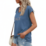 Woman wearing a breathable cotton V-neck t-shirt with "VALE" graphic print, available in Navy Blue, Slate Blue, and Olive Green.