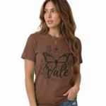 Woman wearing a Vale brand butterfly graphic t-shirt in brown, white, and maroon, featuring a vintage botanical butterfly design on 100% breathable cotton fabric.