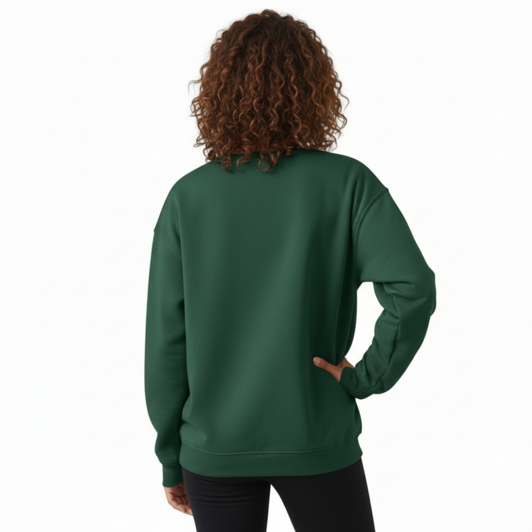 Woman wearing a VALE graphic cotton sweatshirt featuring a swallow, butterfly, and botanical nature design in Forest Green, Black, and Purple colors.