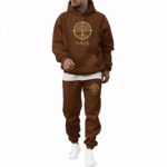 Men's oversized 2-piece tracksuit featuring a breathable cotton hoodie and joggers with gold VALE Tree of Life compass logo, available in Mocha Brown, Sand Beige, and Fuchsia Pink.