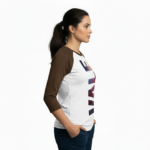Person wearing a 3/4 sleeve raglan cotton shirt featuring a vertical VALE galaxy-textured graphic print.