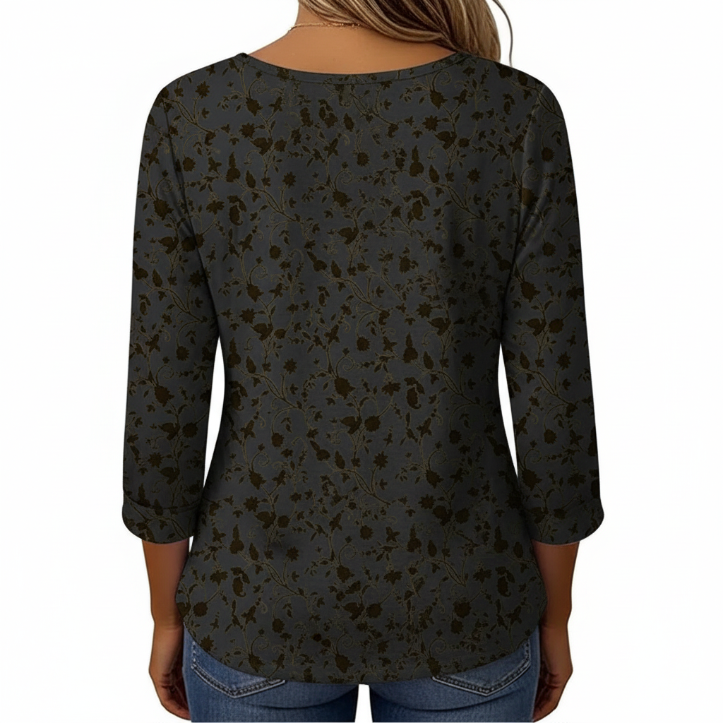 Women's breathable floral cotton blouse with VALE gold embroidery and pleated button-front design.
