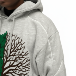 Men's 2-piece streetwear tracksuit set made of breathable cotton featuring white contrast piping, a split-tree graphic logo, and wide-leg joggers in Grey, Blue, and Purple colors.