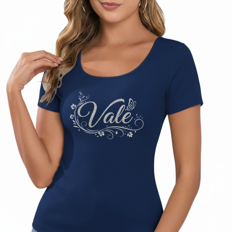 Close-up of a woman wearing a breathable ribbed cotton t-shirt featuring a glittery "Vale" graphic design with floral accents.