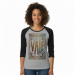 Woman wearing a VALE Art Deco graphic raglan shirt made of breathable cotton with black 3/4 sleeves, available in cream, maroon, and grey.