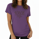 Woman wearing a VALE brand graphic t-shirt in breathable cotton, featuring a minimalist leaf design and athletic slim fit. Available in Black, Purple, and Orange.
