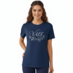 A female model showcasing the VALE branded floral graphic t-shirt in Navy Blue, Black, and White. 100% breathable cotton fabric featuring a silver script logo and elegant floral wreath design on a clean white background.