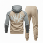 Back and front view of VALE brand breathable cotton tracksuit featuring a large shield logo, raglan sleeves, and matching joggers on a white background.