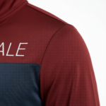 Men's breathable cotton tracksuit featuring a forest silhouette and key graphic print, available in green, orange, and maroon color blocks.