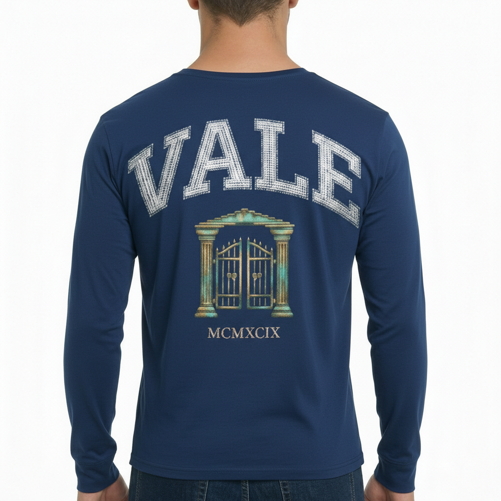 VALE Heritage Graphic Long-Sleeve Shirt Back view of a man wearing a VALE graphic long-sleeve cotton shirt featuring a vintage gate design and Roman numerals MCMXCIX.