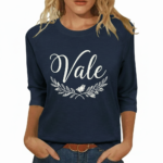 Woman wearing a "Vale" floral graphic 3/4 sleeve breathable cotton shirt in black, navy, and forest green.
