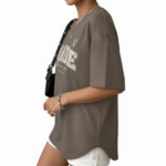 Flat lay and model view of women's oversized "MADE Pure Joy" floral graphic t-shirt in dusty brown, slate blue, and sage green.