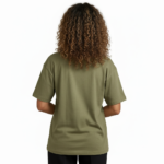 Young woman wearing a "Vale Girl" breathable cotton t-shirt with a vintage floral and hummingbird graphic design, available in Olive Green, Royal Blue, and Red.
