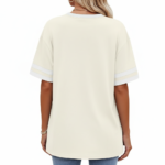 Woman wearing VALE graphic cotton t-shirt with striped sleeves and laurel wreath design in Blue, Plum, and Cream colors.