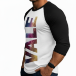 Men's athletic slim fit 3/4 sleeve raglan shirt featuring a vertical "VALE" textured graphic print on breathable cotton fabric.