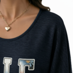 Women's breathable cotton scoop neck shirt featuring a floral 'VALE' graphic and smocked 3/4 sleeves, available in Charcoal, Navy, and Green.