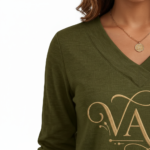 Women wearing a VALE branded long-sleeve breathable cotton V-neck t-shirt in navy blue, mustard yellow, and olive green, paired with blue jeans.