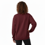 "Professional studio shot of a woman wearing a VALE brand cotton sweatshirt featuring a detailed fox and moon graphic design, available in Maroon, Forest Green, and Heather Gray."