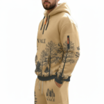 Men's designer wilderness-themed tracksuit set featuring a quarter-zip hoodie and cargo joggers with forest and deer landscape prints on breathable cotton.
