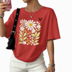 Women's oversized breathable cotton t-shirt featuring a vintage daisy floral print in sage green, brown, and red colors.