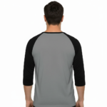 Men's VALE patchwork raglan shirt in white, grey, and cream with black and brown 3/4 sleeves, featuring decorative textured lettering.