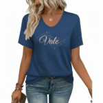 Woman wearing a "Vale" floral print V-neck cotton t-shirt with a chest pocket, available in blue, red, and grey.