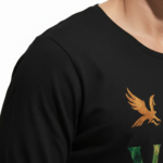 A man wearing a long-sleeve cotton shirt with a "VALE" nature graphic featuring a mountain, eagle, and tree, available in cream, black, and chocolate brown.