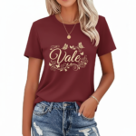 Women wearing Vale branded cotton graphic t-shirt with butterfly and floral swirl design, available in Maroon, Grey, and Cream colors.