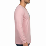 A man wearing a long-sleeved cotton shirt featuring a vertical watercolor tree design with the word "VALE" hidden in the trunk and branches.