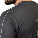 Front and back view of a man wearing the VALE brand breathable cotton performance tracksuit, featuring a vertical outline logo on the t-shirt back and matching side-striped joggers on a white background.