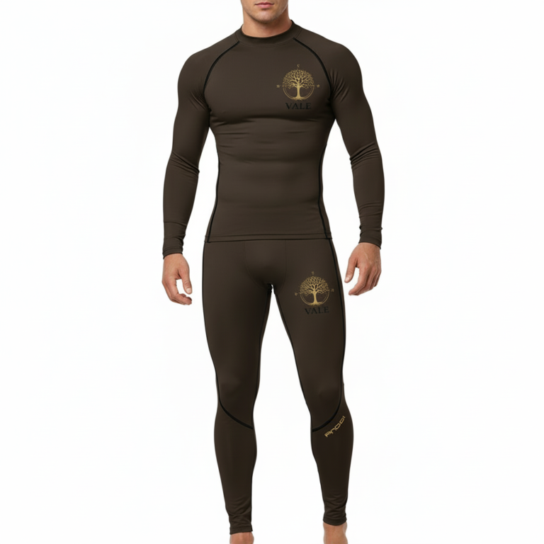 Front view of a man wearing a VALE brand 2-piece compression suit featuring a gold Tree of Life mandala graphic on the long-sleeve top and matching leggings, shown in brown, olive green, and grey colors.