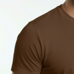 Front view of a man wearing a breathable cotton slim-fit t-shirt with a small white minimalist V-logo on the chest, available in navy, brown, and olive.